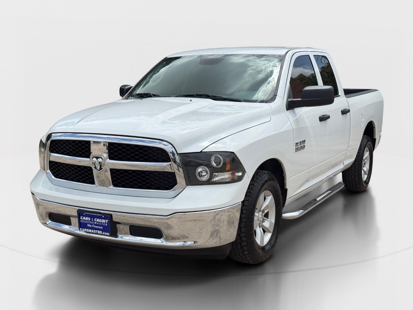 2017 RAM 1500 Tradesman Quad Cab 2WD in Pearl White — front three-quarter view