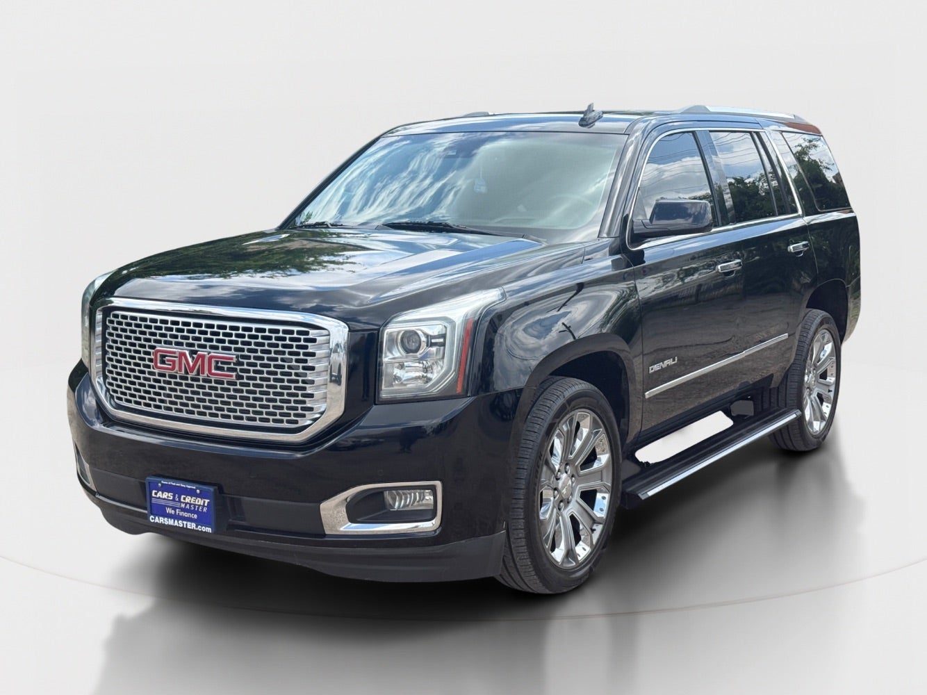 2015 GMC Yukon Denali 4WD in Onyx Black — front three-quarter view