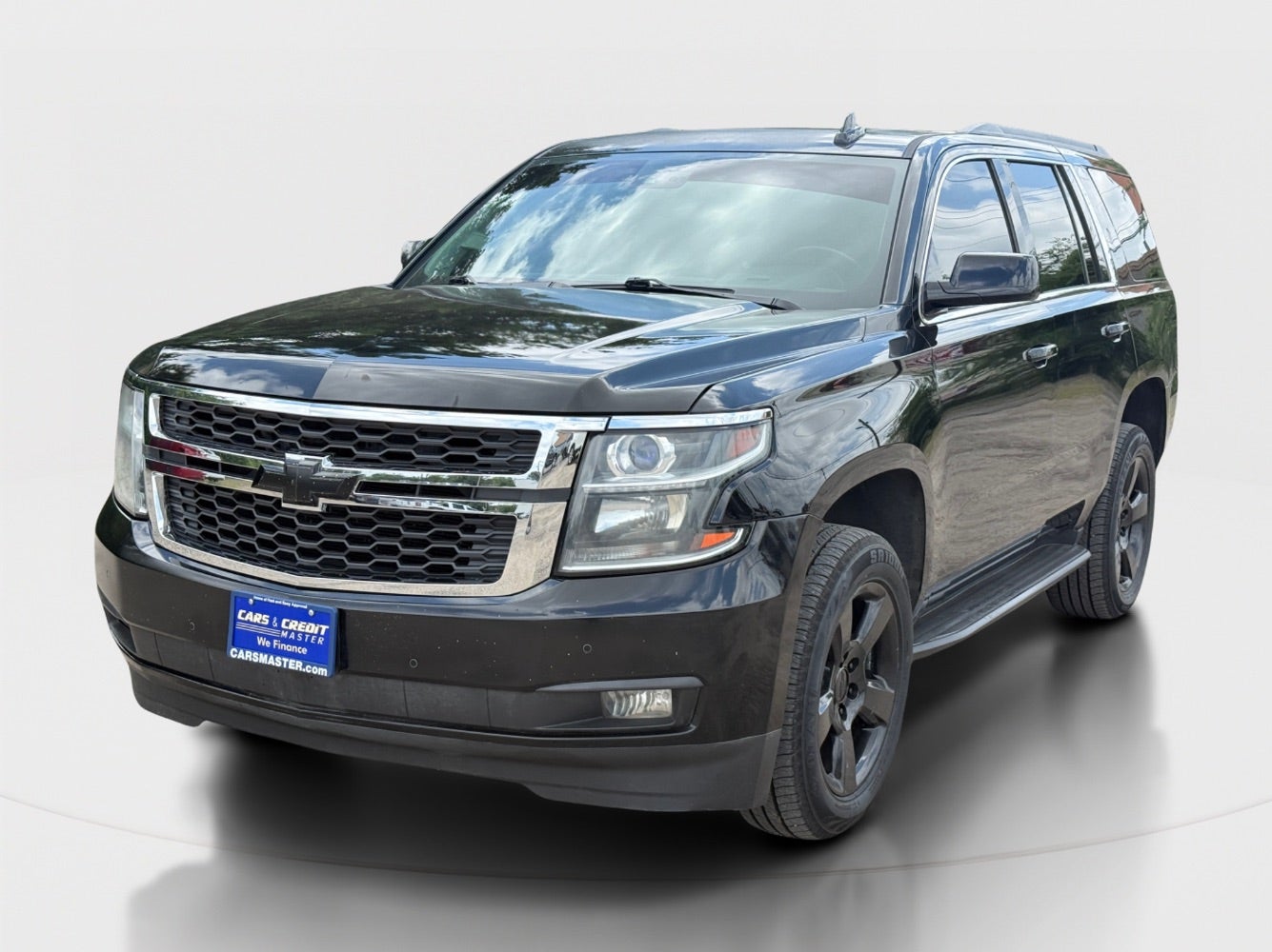 2016 Chevrolet Tahoe LT 4WD in Black — front three-quarter view