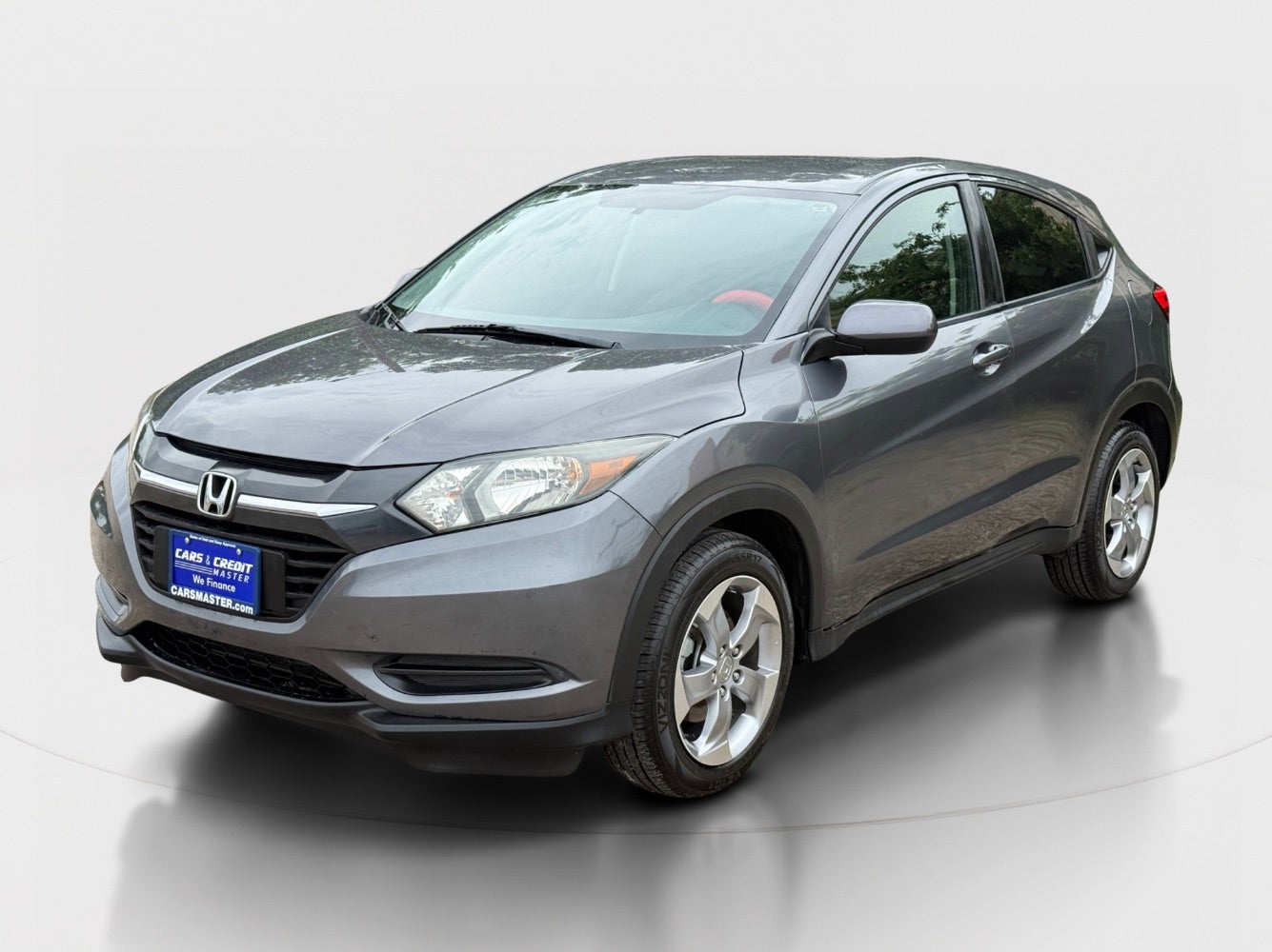 2018 Honda HR-V LX 4WD CVT in Modern Steel Metallic — front three-quarter view